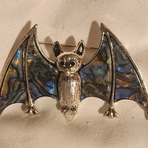 silvertone bat pendant with faux abalone pearl wings